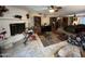 Bright living room with a white brick fireplace, tile flooring, and a comfortable seating area at 4626 W Altadena Ave, Glendale, AZ 85304