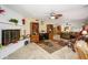 Bright living room with tile floors, fireplace, and eclectic decor at 4626 W Altadena Ave, Glendale, AZ 85304