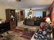 Spacious living room with tile flooring, furniture, and a large area rug at 4626 W Altadena Ave, Glendale, AZ 85304