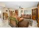 Spacious living room with tile floors, a sofa, and eclectic decor at 4626 W Altadena Ave, Glendale, AZ 85304