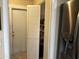 Pantry with shelving and bi-fold doors, located next to stainless steel refrigerator at 4626 W Altadena Ave, Glendale, AZ 85304