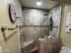 Tiled shower featuring a built-in bench, shower head, and niche with a mosaic accent border at 4626 W Altadena Ave, Glendale, AZ 85304