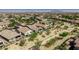 Expansive aerial view of a desert neighborhood with homes, desert landscaping and scenic mountain backdrop at 4898 N 206Th Ln, Buckeye, AZ 85396