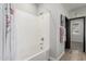 Bathroom with a white bathtub and shower combination at 4898 N 206Th Ln, Buckeye, AZ 85396
