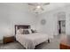 Bedroom with a comfortable bed, bedside tables, lamps, and an en-suite bathroom at 4898 N 206Th Ln, Buckeye, AZ 85396
