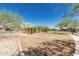 Picturesque community park featuring manicured lawn, shade trees, and a gazebo, ideal for outdoor recreation and relaxation at 4898 N 206Th Ln, Buckeye, AZ 85396