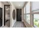 Welcoming entryway featuring a stylish front door, modern flooring, and plenty of natural light at 4898 N 206Th Ln, Buckeye, AZ 85396