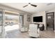 Inviting living room with sliding glass doors leading to an outdoor patio at 4898 N 206Th Ln, Buckeye, AZ 85396