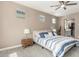 Comfortable bedroom with a plush bed, two bedside tables with lamps, and carpeted floors at 4898 N 206Th Ln, Buckeye, AZ 85396