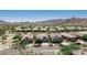 Aerial image of charming homes along the street, showcasing desert landscaping and stunning mountain views at 4898 N 206Th Ln, Buckeye, AZ 85396