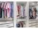 Walk-in closet with organized storage, hanging rods, and shelving units at 4898 N 206Th Ln, Buckeye, AZ 85396