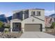 Beautiful two-story home with a neutral color scheme and a mountain backdrop at 4999 E Umber Rd, San Tan Valley, AZ 85143