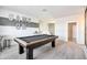 Spacious game room with a pool table and playful decor creates an inviting entertainment space at 4999 E Umber Rd, San Tan Valley, AZ 85143
