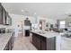 Open kitchen with granite countertops, stainless steel appliances, and a view to the adjacent living spaces at 4999 E Umber Rd, San Tan Valley, AZ 85143