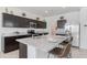 Well-equipped kitchen with granite countertops, stainless steel appliances, and breakfast bar at 4999 E Umber Rd, San Tan Valley, AZ 85143