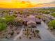 Stunning aerial view of a single-Gathering home with desert landscaping and mountain views at 5712 E Blue Sky Dr, Scottsdale, AZ 85266