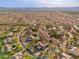 An aerial view showing the neighborhood the house is located in, with mountain views and desert landscaping at 5712 E Blue Sky Dr, Scottsdale, AZ 85266