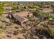 Captivating aerial view showcases lush backyard, sparkling pool, and privacy fencing, with desert foliage at 5712 E Blue Sky Dr, Scottsdale, AZ 85266