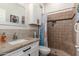 Bathroom featuring a shower and modern vanity with stone countertop and ample storage at 5712 E Blue Sky Dr, Scottsdale, AZ 85266