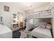 bedroom with bunkbeds, plush rug, and access to a vanity area at 5712 E Blue Sky Dr, Scottsdale, AZ 85266