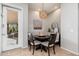 Cozy breakfast nook with a round table, cushioned seating, and stylish lighting fixture at 5712 E Blue Sky Dr, Scottsdale, AZ 85266