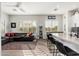 Bright open living area with modern furniture and an open layout leading to the kitchen area at 5712 E Blue Sky Dr, Scottsdale, AZ 85266