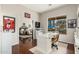 Bright home office with large window, hardwood floors, and view into adjacent bedroom at 5712 E Blue Sky Dr, Scottsdale, AZ 85266