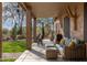 Covered patio with desert views, outdoor seating, and lush landscaping at 5712 E Blue Sky Dr, Scottsdale, AZ 85266