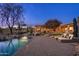 Stunning backyard pool area with comfortable lounge chairs and desert landscaping at 5712 E Blue Sky Dr, Scottsdale, AZ 85266