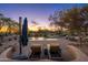 Inviting pool area with lounge chairs and stunning desert landscaping at 5712 E Blue Sky Dr, Scottsdale, AZ 85266