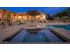 Sparkling pool and spa with lush landscaping and a spacious patio for entertaining at 5712 E Blue Sky Dr, Scottsdale, AZ 85266