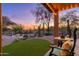 Inviting poolside patio with comfortable seating, desert landscaping and sunset views at 5712 E Blue Sky Dr, Scottsdale, AZ 85266