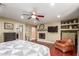 Cozy bedroom featuring a fireplace, hardwood floors, and plenty of room at 6532 E Aster Dr, Scottsdale, AZ 85254