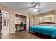 Bedroom featuring space for a desk, hardwood floors, and a ceiling fan at 6532 E Aster Dr, Scottsdale, AZ 85254