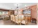Elegant dining room with ornate chairs, chandelier, and hutch at 6532 E Aster Dr, Scottsdale, AZ 85254