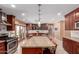Bright kitchen featuring updated stainless steel appliances, a large island, and a seamless transition to the backyard at 6532 E Aster Dr, Scottsdale, AZ 85254