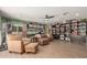 Open-concept living room with hardwood floors, a ceiling fan, and plenty of natural light at 6532 E Aster Dr, Scottsdale, AZ 85254
