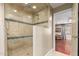 Updated shower with a glass door and decorated with nice tile accents at 6532 E Aster Dr, Scottsdale, AZ 85254