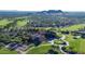 Aerial view of golf course community with lush landscaping, pools, and mountain views, ideal for luxury living at 6551 E Flat Iron Loop, Gold Canyon, AZ 85118