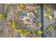 An aerial top-down view of a home, featuring desert landscaping, a private pool and outdoor living spaces at 6551 E Flat Iron Loop, Gold Canyon, AZ 85118