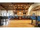 A fully stocked bar with a dark wood finish provides a great place for entertaining guests at 6551 E Flat Iron Loop, Gold Canyon, AZ 85118