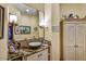 Elegant bathroom featuring a unique vessel sink, granite countertops, and custom cabinetry at 6551 E Flat Iron Loop, Gold Canyon, AZ 85118