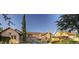 Stunning exterior of the Superstition Mountain clubhouse, surrounded by beautiful landscaping and clear blue skies at 6551 E Flat Iron Loop, Gold Canyon, AZ 85118