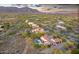 Luxury home situated in a gated community, showcasing desert landscaping and mountain views at 6551 E Flat Iron Loop, Gold Canyon, AZ 85118