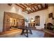Spacious lobby area with fireplace, tile floors, and coffered ceilings in this luxurious property at 6551 E Flat Iron Loop, Gold Canyon, AZ 85118