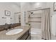Well-lit bathroom with granite countertops and tile surround shower at 6706 S Jacqueline Way, Gilbert, AZ 85298