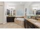 This bathroom features a soaking tub, dual sinks, designer tile, and white plantation shutters at 6706 S Jacqueline Way, Gilbert, AZ 85298
