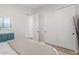 Bedroom boasts a painted blue dresser and sliding closet doors at 6706 S Jacqueline Way, Gilbert, AZ 85298