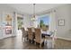 Dining area featuring a large window with bright lighting and wood table with seating at 6706 S Jacqueline Way, Gilbert, AZ 85298