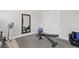This is an exercise room with equipment, mirror, and plantation shutters at 6706 S Jacqueline Way, Gilbert, AZ 85298